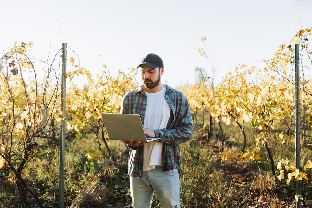 farmer-in-field-with-laptop